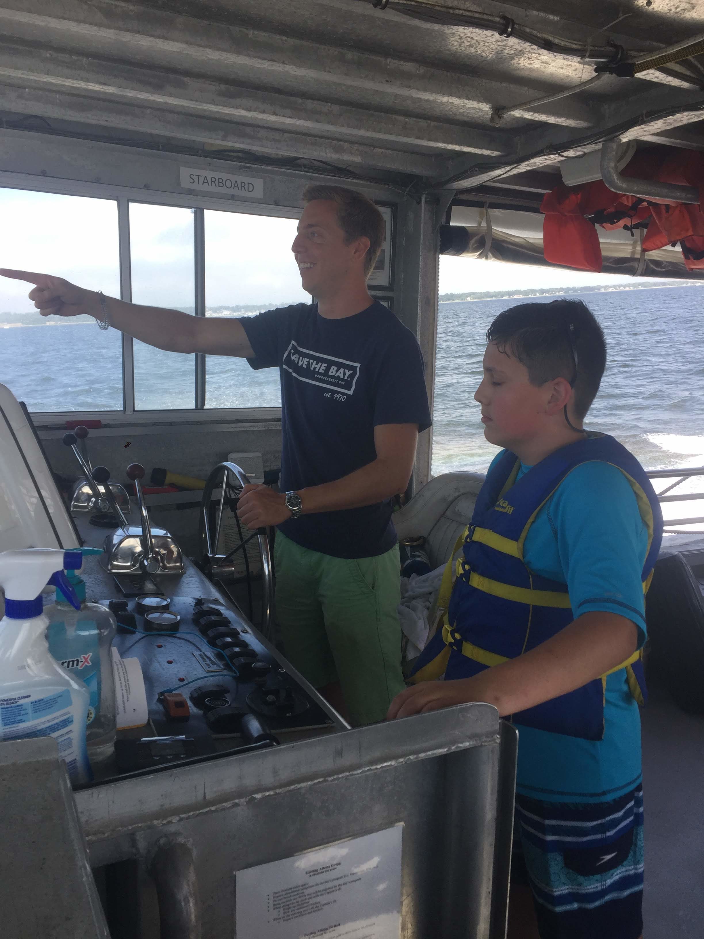 Captain Chris Dodge talks with a BayCamper aboard the Aletta Morris.
