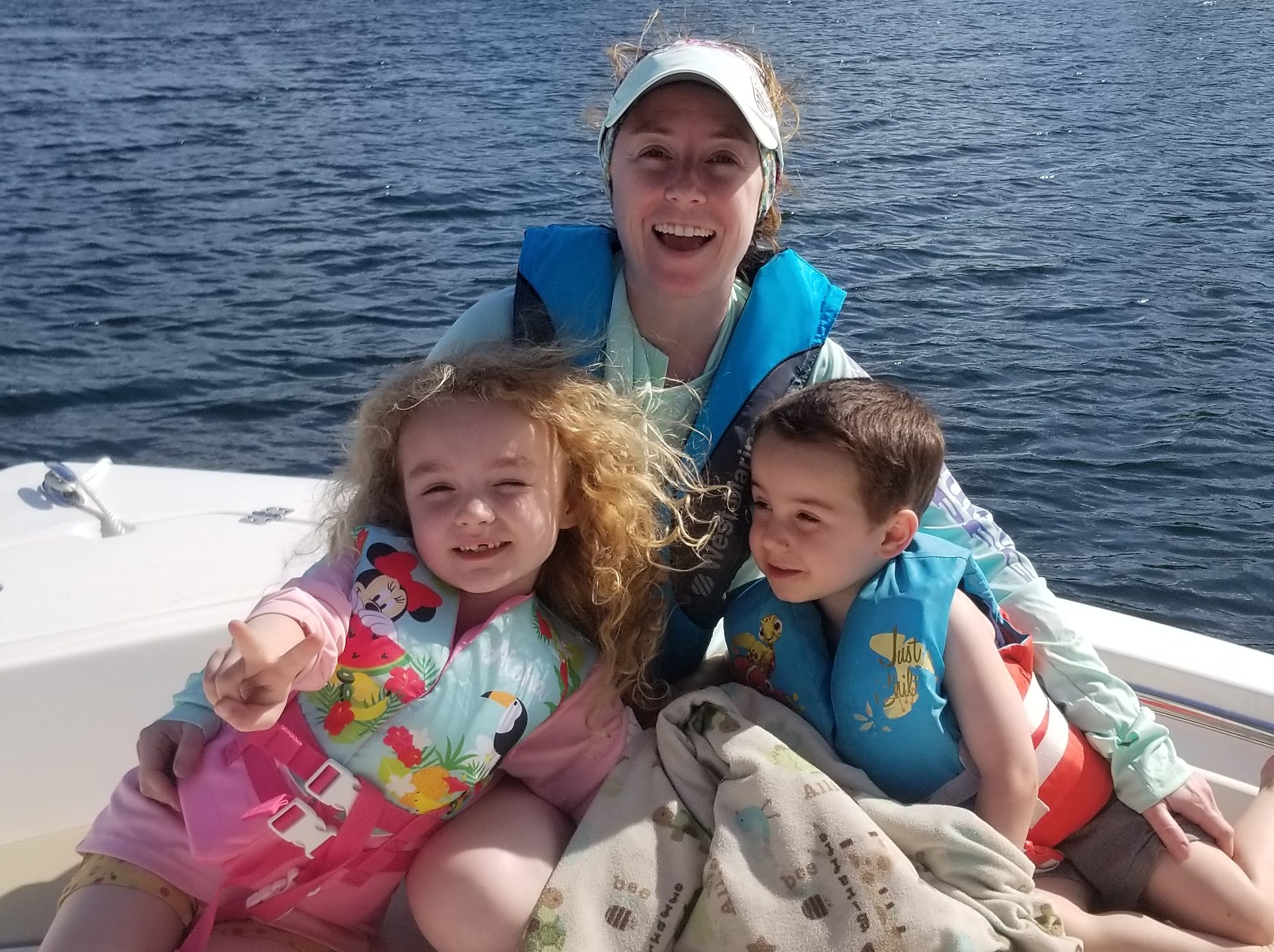 Woman-with-her-two-kids-on-a-boat